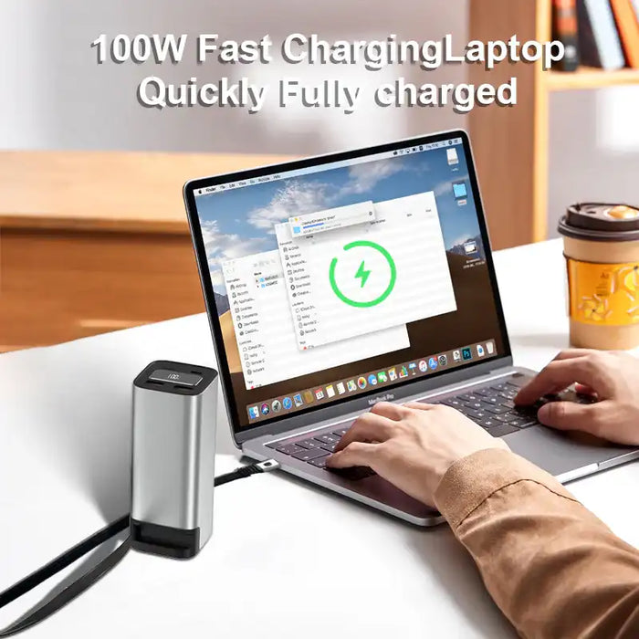 100W fast charging 20000mAh power bank connected to laptop on desk with coffee cup in background TUTT