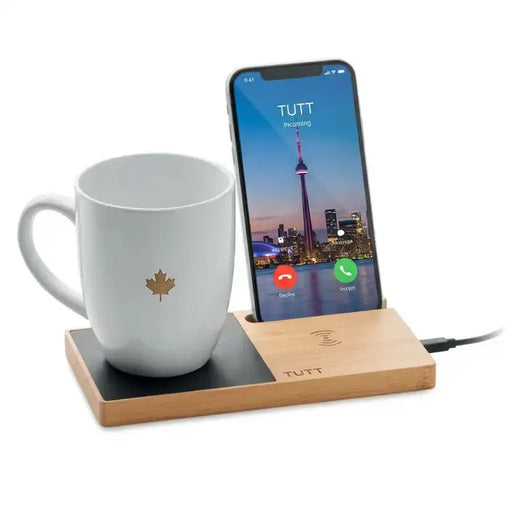 Phone dock with a mug on a white background TUTT 15W Wireless Phone Charger – Bamboo Cup Warmer & Phone Stand
