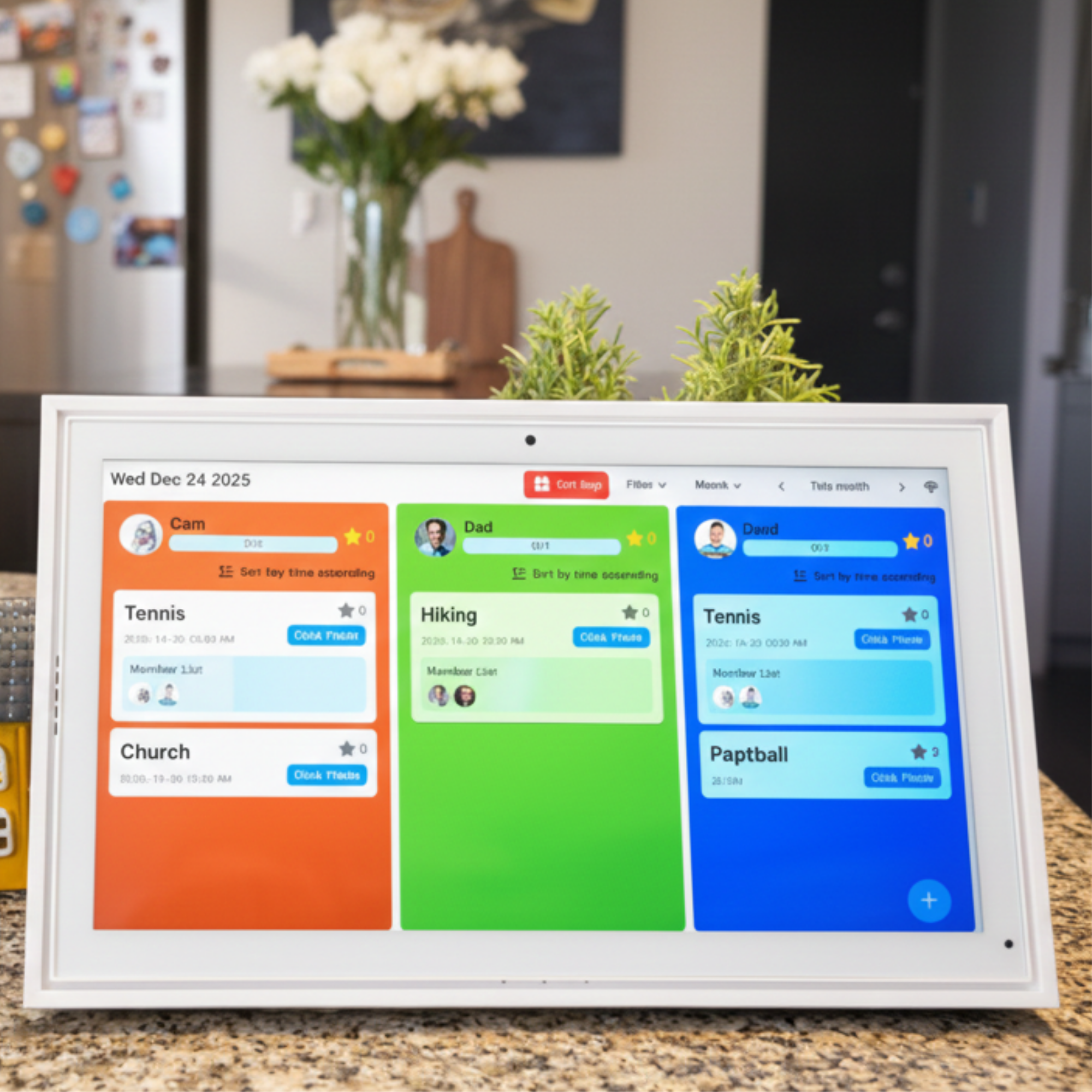 Digital family calendar display showing schedules for Cam, Dad, and David on a kitchen countertop with plants in background TUTT