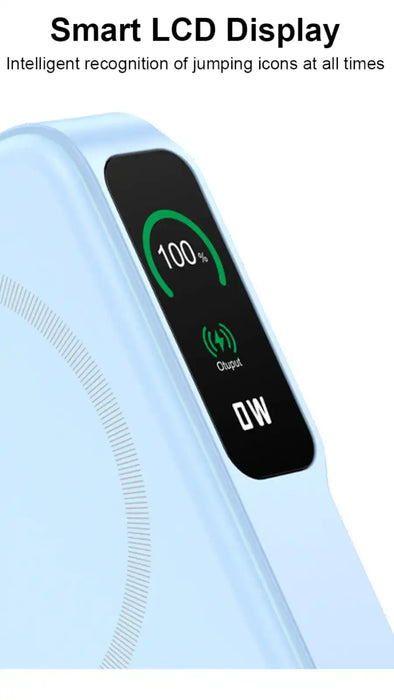Close-up of light blue power bank with smart LCD displaying 100% charge and output 0W, wireless charging ring visible TUTT