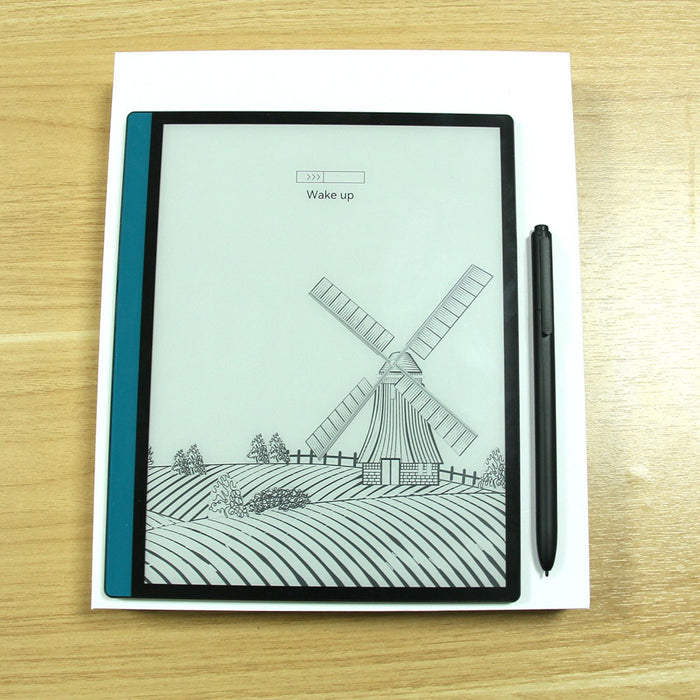 E-reader with black stylus pen on wooden table displaying windmill sketch and wake up loading bar TUTT