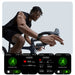 Man cycling indoors wearing black ECG smartwatch with fitness tracking screens, TUTT