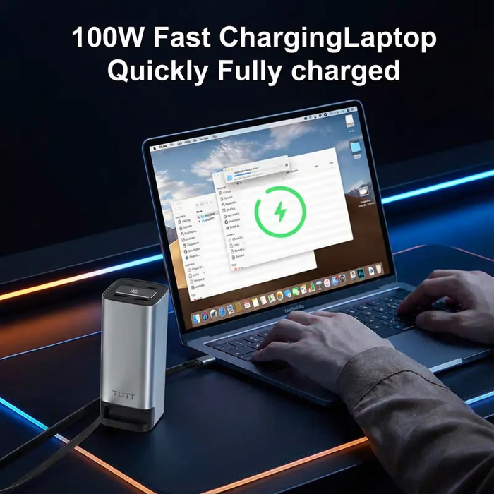 Laptop with fast charging device on a dark surface, text indicating 100W fast charging capability. TUTT Monitor, Laptop Power Bank 100W 20,000mAh Retractable Cable LCD Display L1