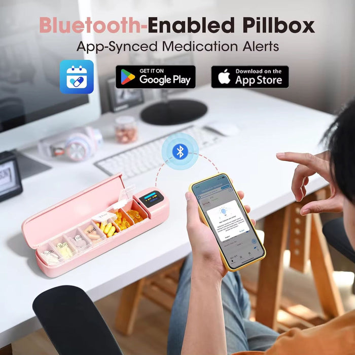 Bluetooth-enabled pink weekly pill organizer with app-synced medication alerts on smartphone in office setting TUTT