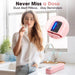 Young woman in white shirt drinking water in kitchen with pink smart pill organizer, digital screen shows 10:00 AM, music notes indicate alert sound, medication reminder device TUTT