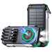 Black rugged 30000mAh solar power bank with built-in cables, wireless charging, and dual LED flashlight TUTT