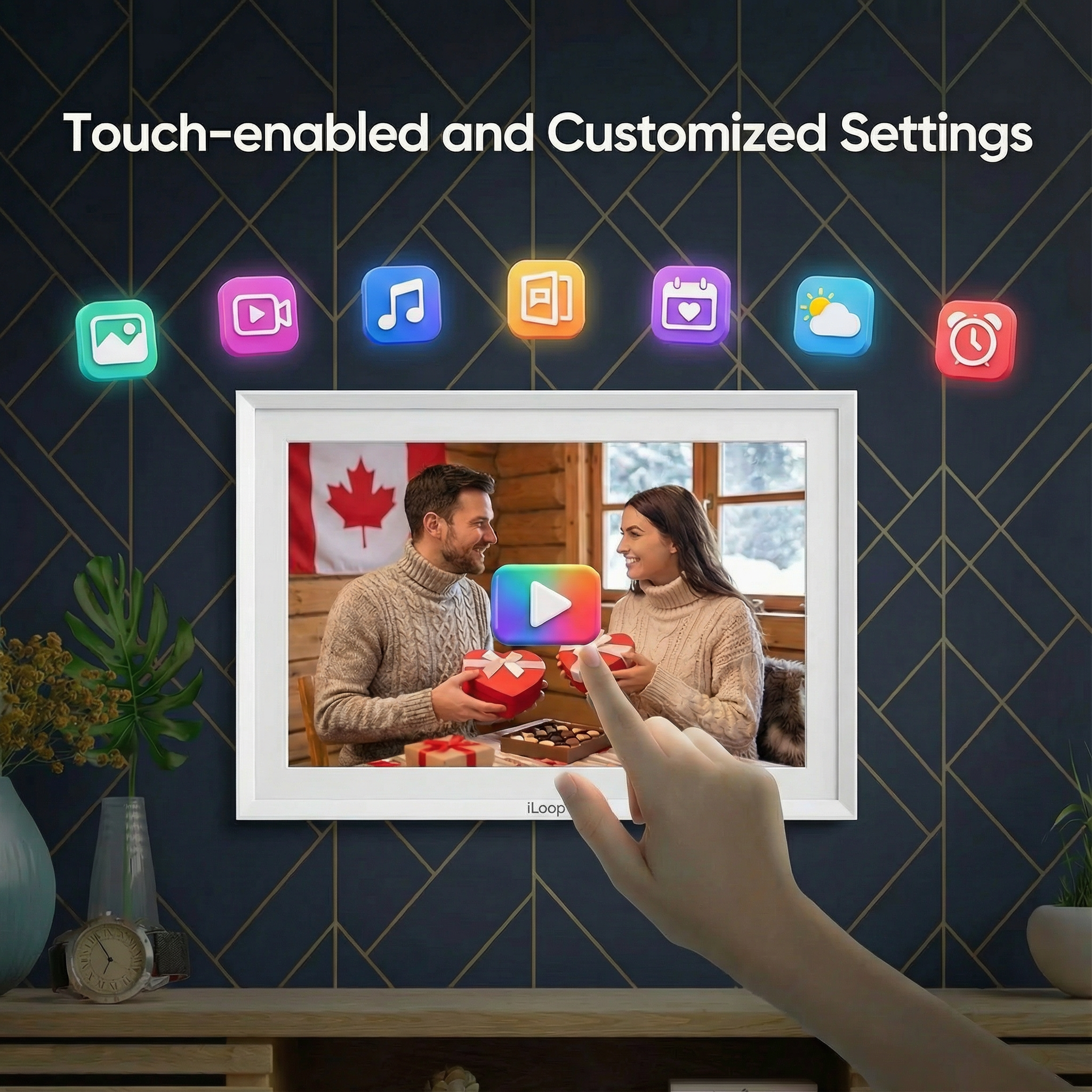 Smart photo frame displaying a couple with a hand touching it, against a dark blue wall with decorative elements. iloop 15.6” Digital Photo Frame | WiFi Touch Screen, 32 GB | Frameo App | Tabletop or Wall-Mounted